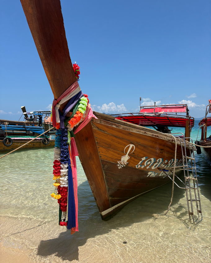 Traditional Thai long-tail boats on the turquoise water of Koh Lanta
