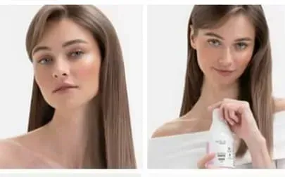 Una mujer con cabello largo sostiene una botella de champú.