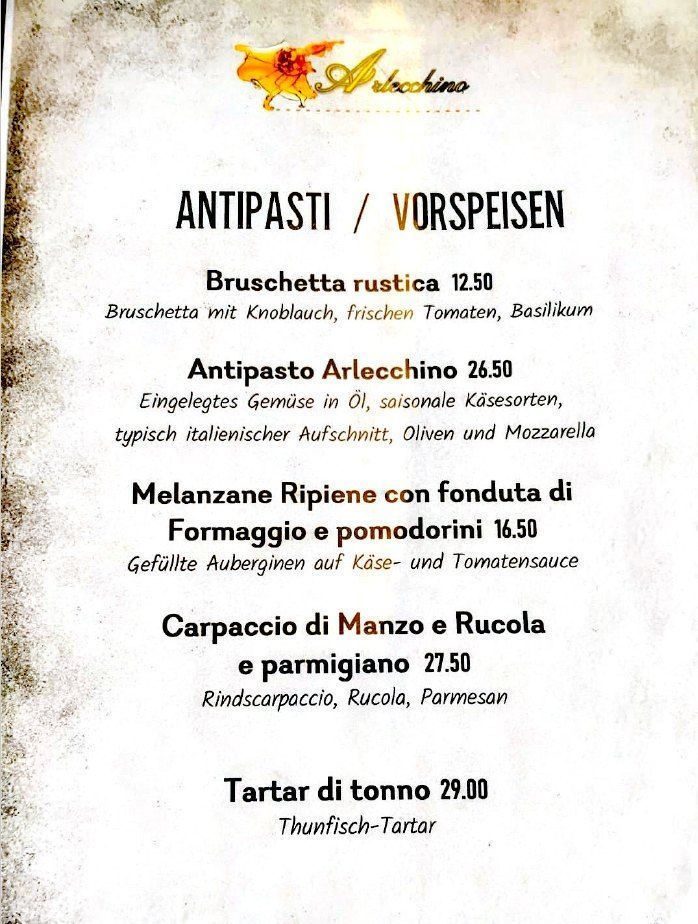 Speisekarte mit italienischen Vorspeisen auf Deutsch, darunter Bruschetta, Antipasti, Carpaccio und Tatar.
