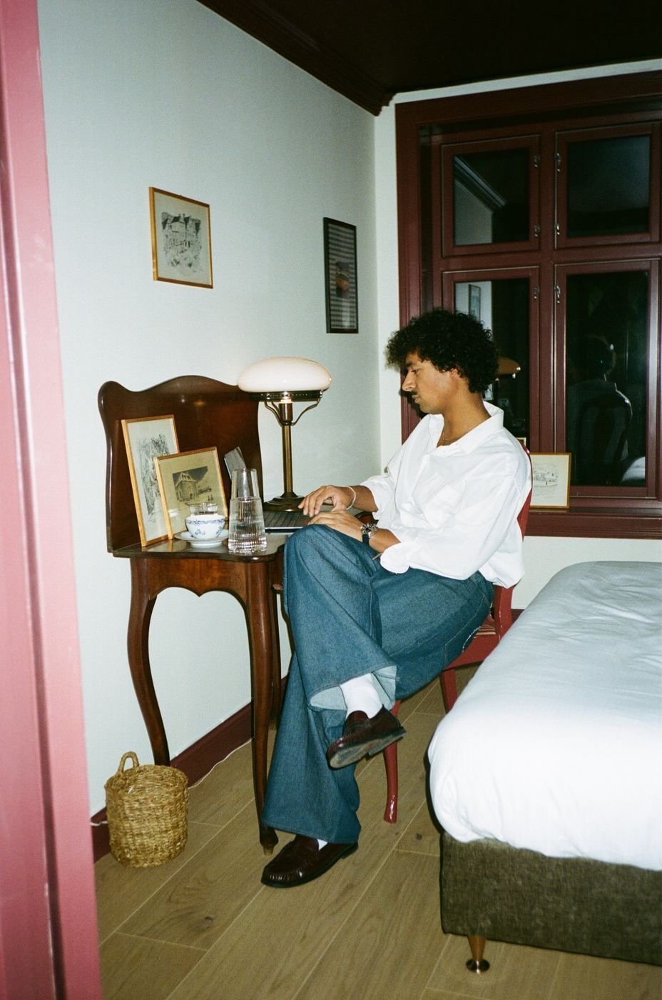 A guest working at a desk by the window