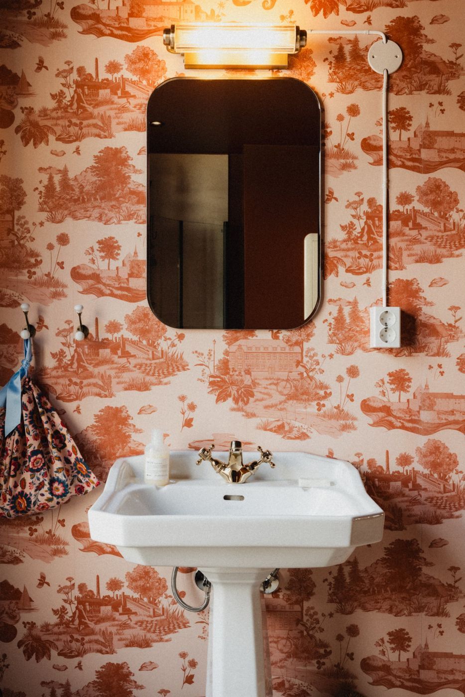 Placeholder: bathroom with patterned wallpaper and a pedestal sink