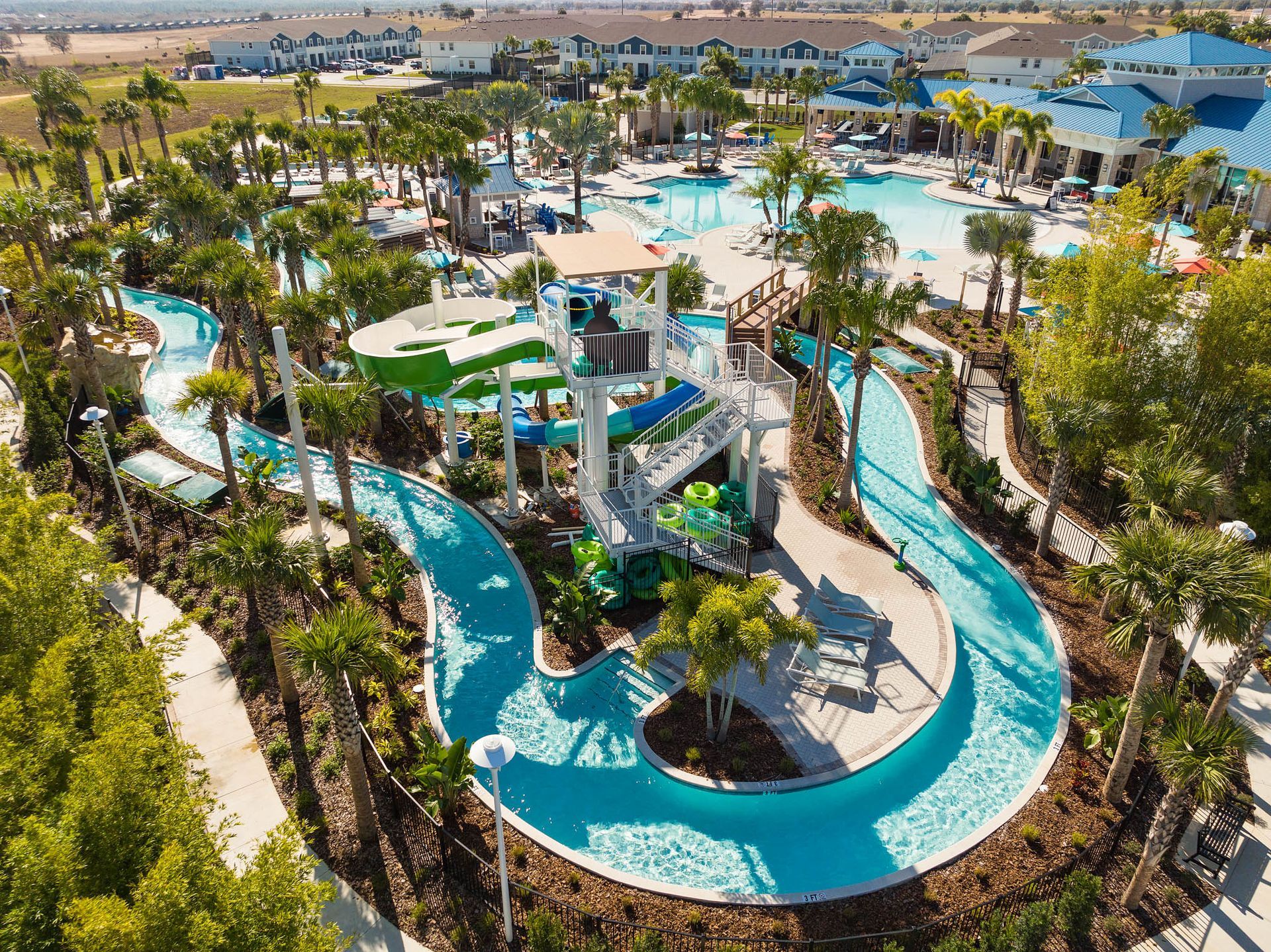 Aerial view of Windsor Cay Resort in Clermont, showcasing pools and lush landscape for luxury family vacations.