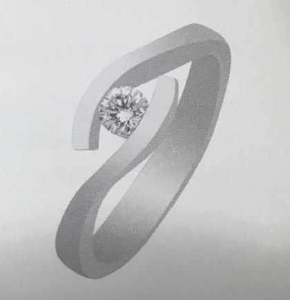 Un anillo de plata con un diamante en el centro