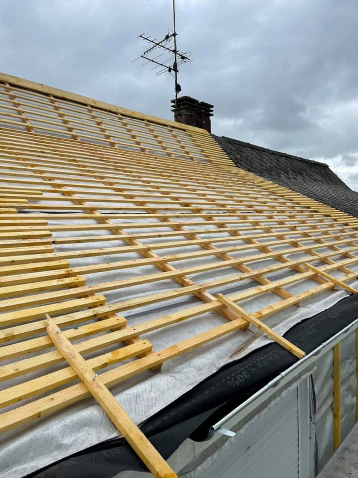 Extension d'une toiture en ardoise