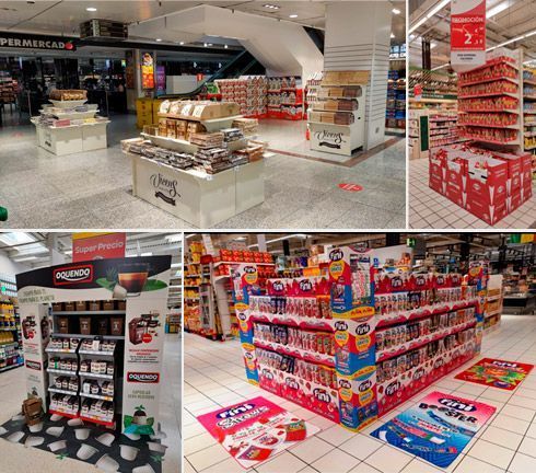 Exhibidores de supermercado: productos surtidos en estantes y exhibidores de piso con señalización promocional, varios colores, ambiente minorista.