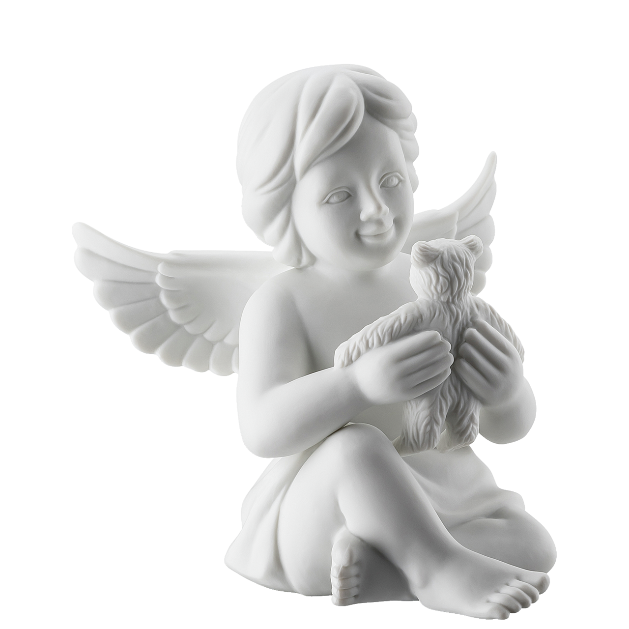Weiße Engelsstatue, die einen Teddybären hält und lächelt.