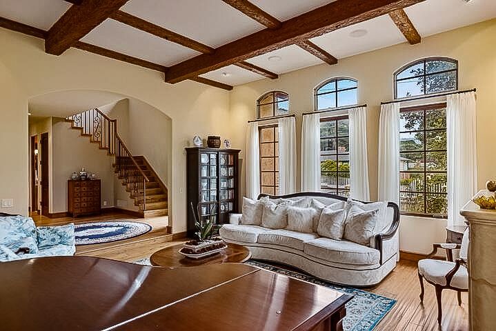 A large house with a brick walkway leading to the front door