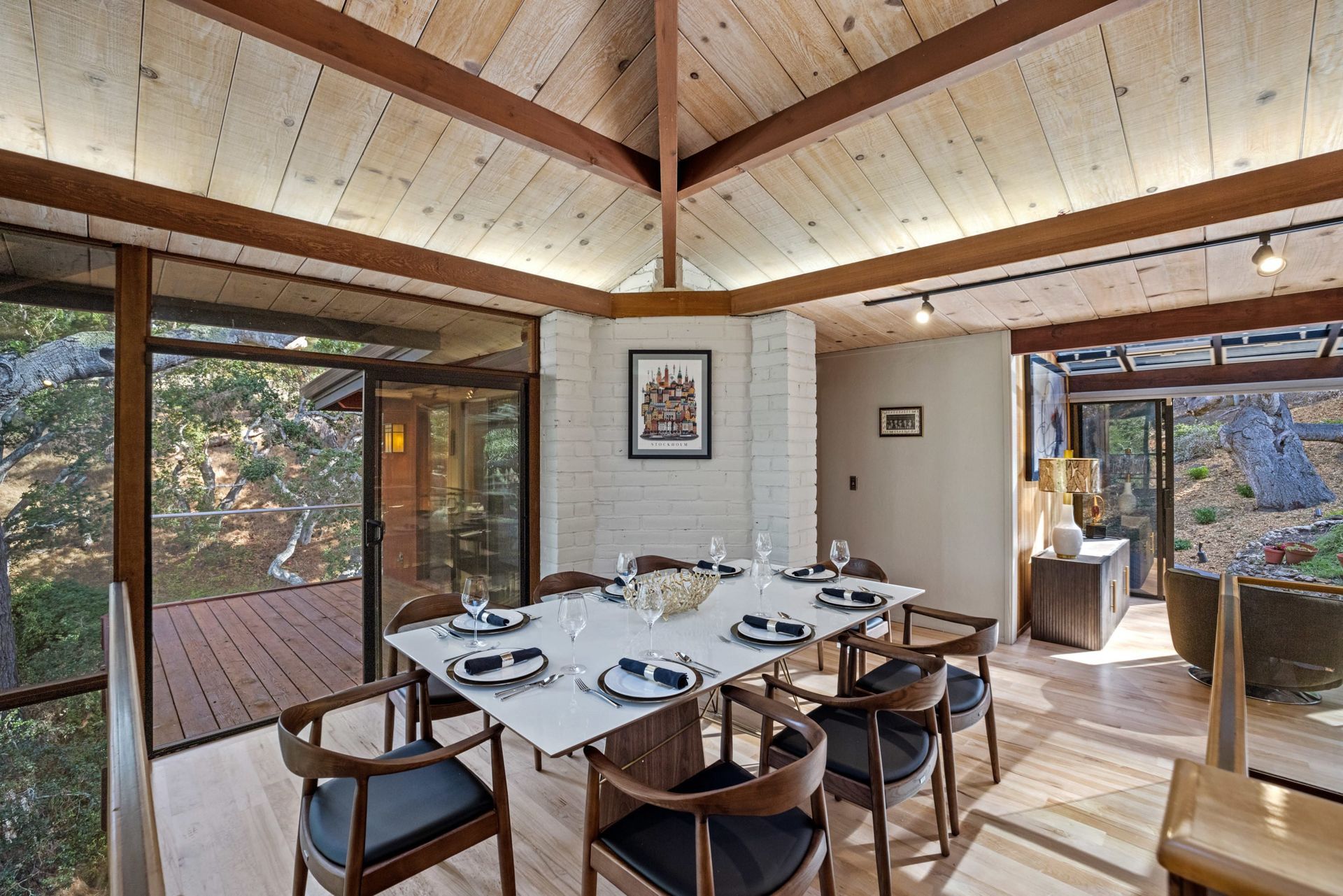 A dining room with a table and chairs in it