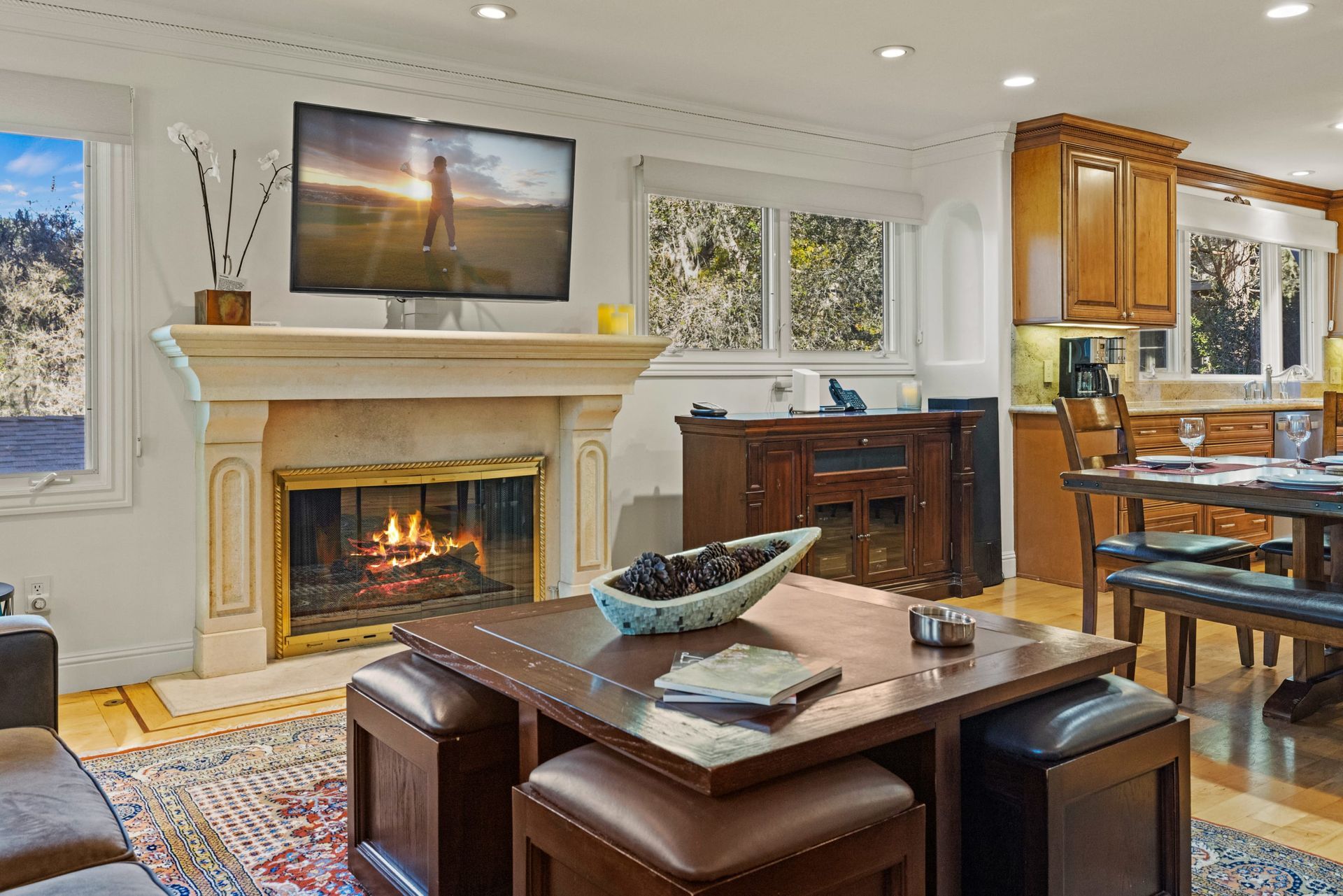 A house with a balcony and a tree in front of it