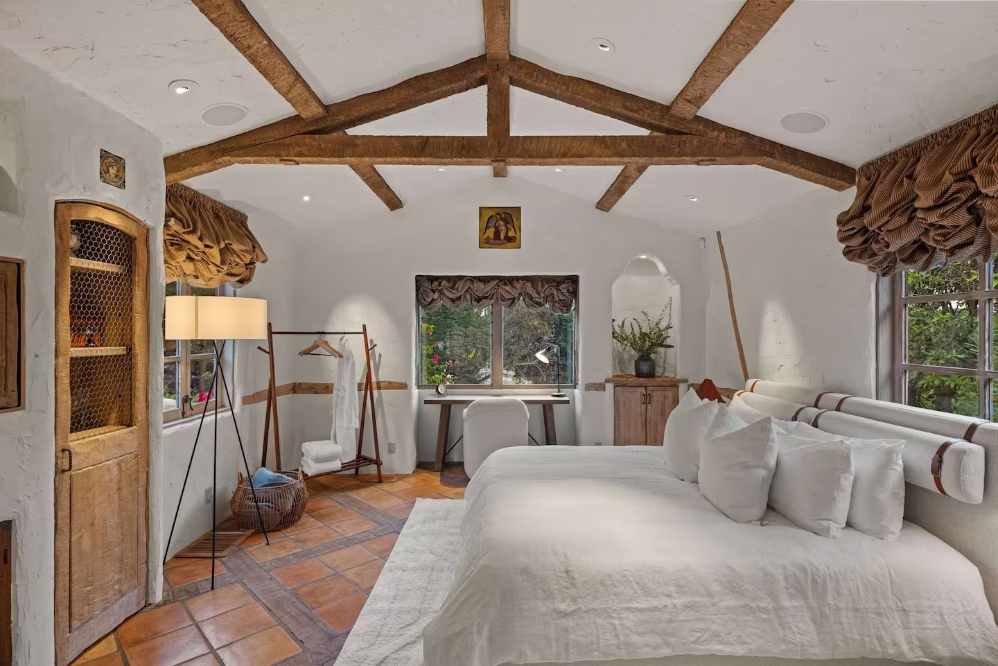 There is a large bed in the middle of the room.