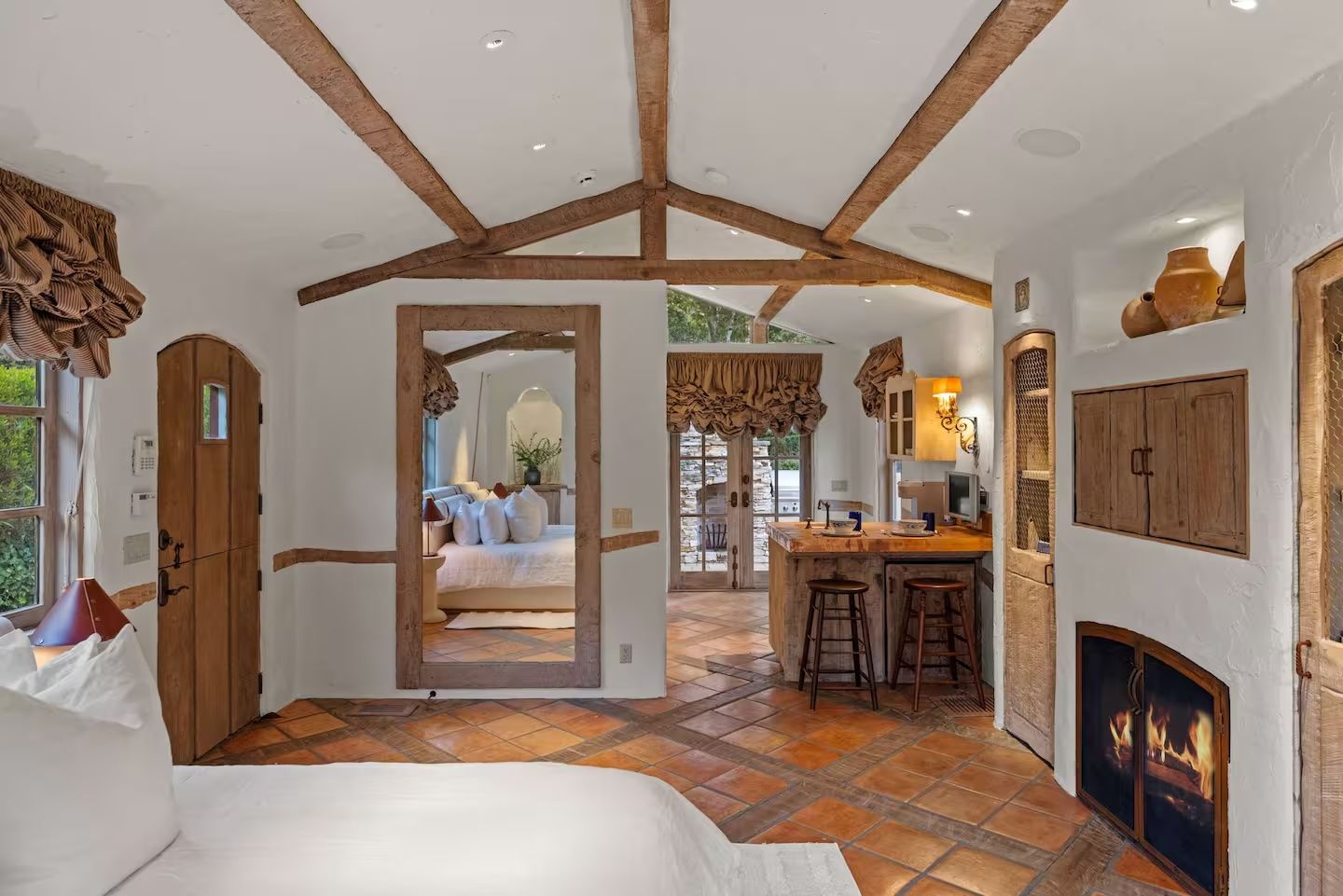 There is a fireplace in the middle of the room.