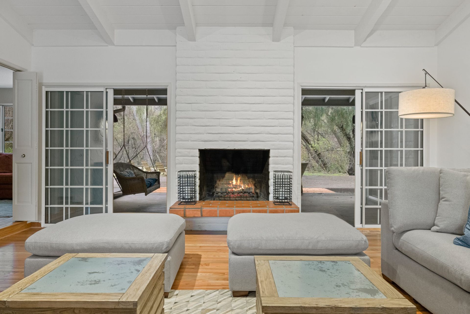 A living room with a fireplace and sliding glass doors