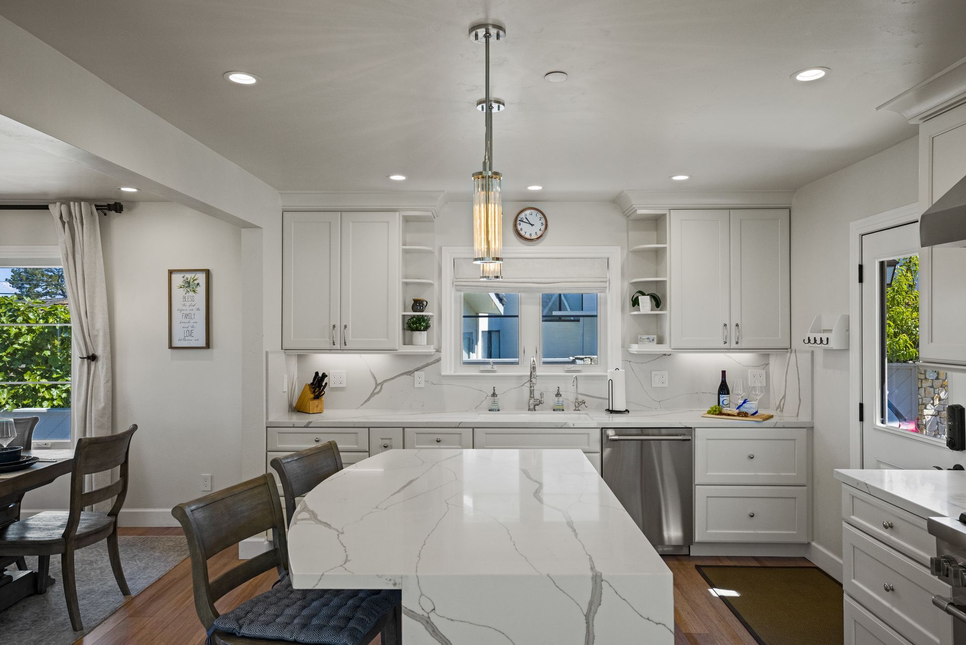 The front of a white house with a black door