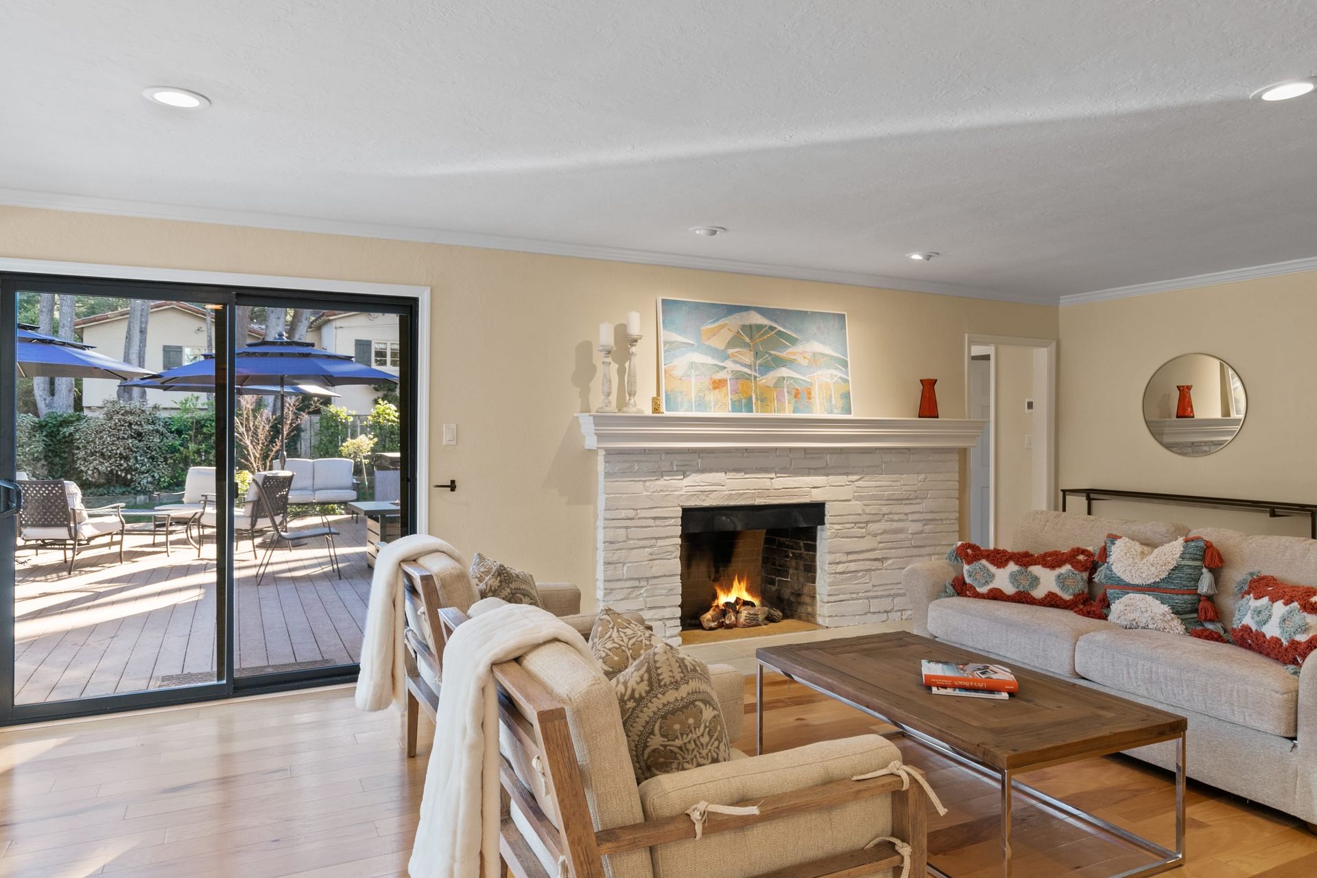 A living room with a fireplace , couch , chair and coffee table.