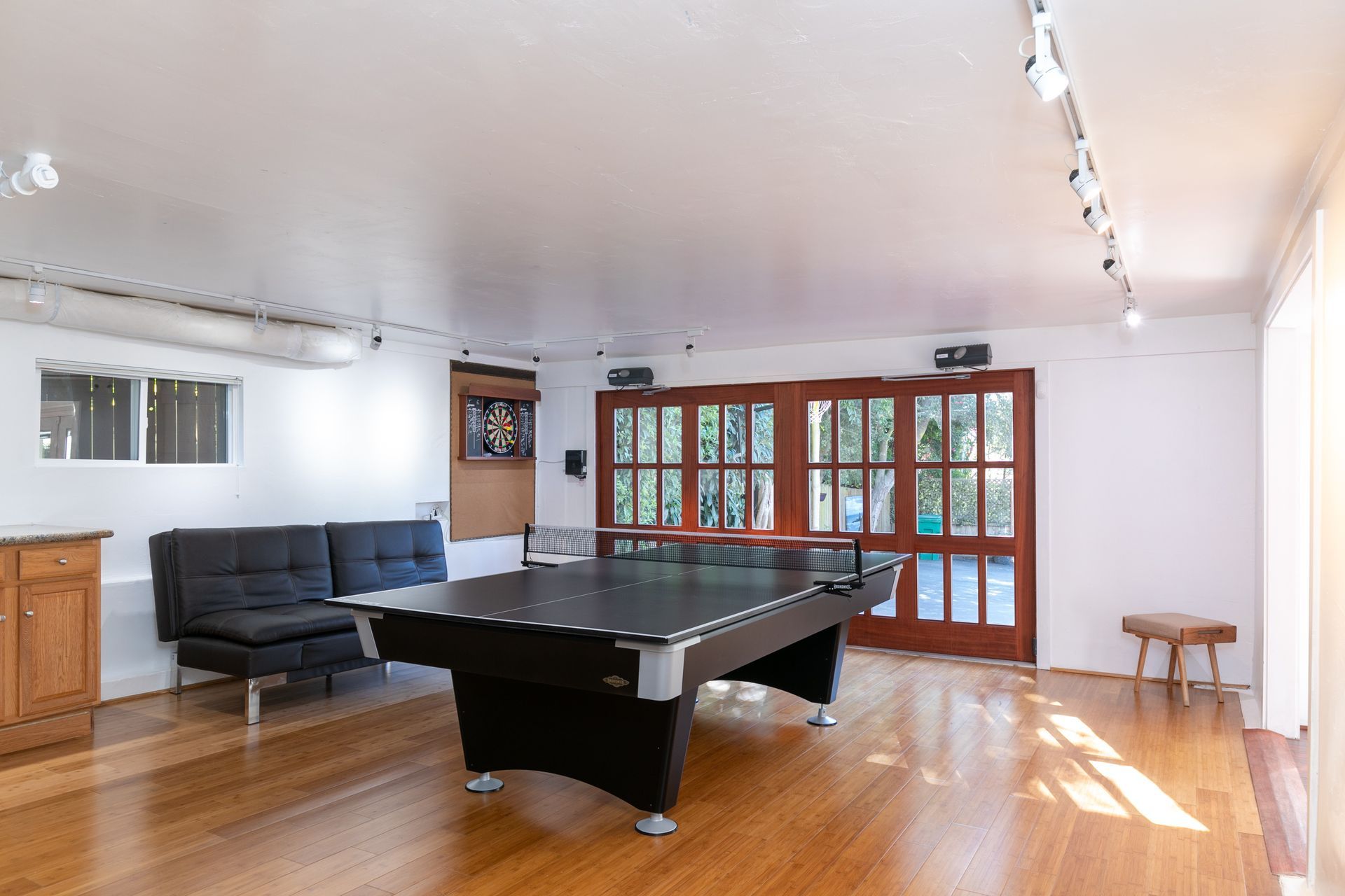 There is a pool table in the middle of the room.