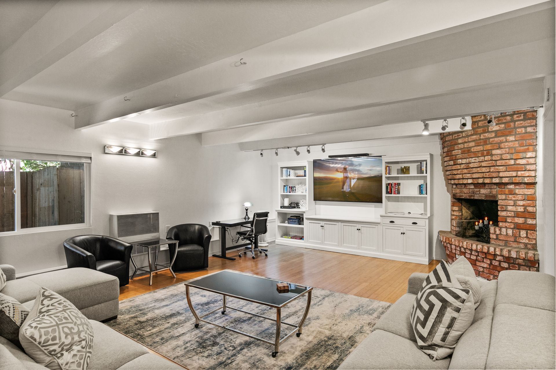 A living room filled with furniture and a fireplace.