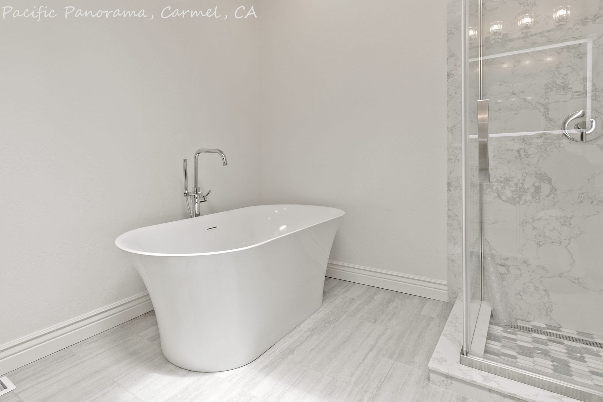 A bathroom with a bathtub and a walk in shower