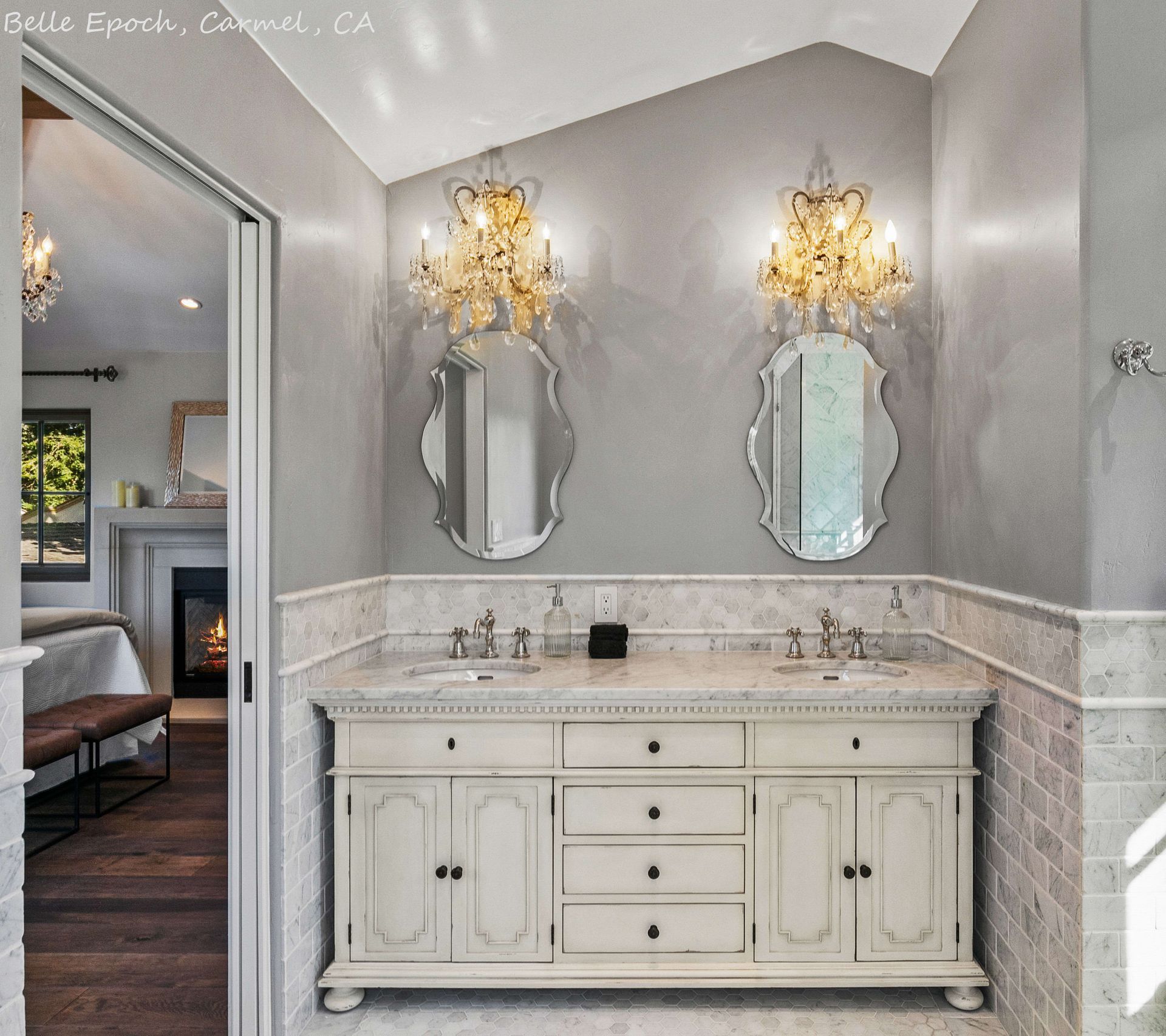 A bathroom with two sinks and two mirrors with the word belle on the bottom