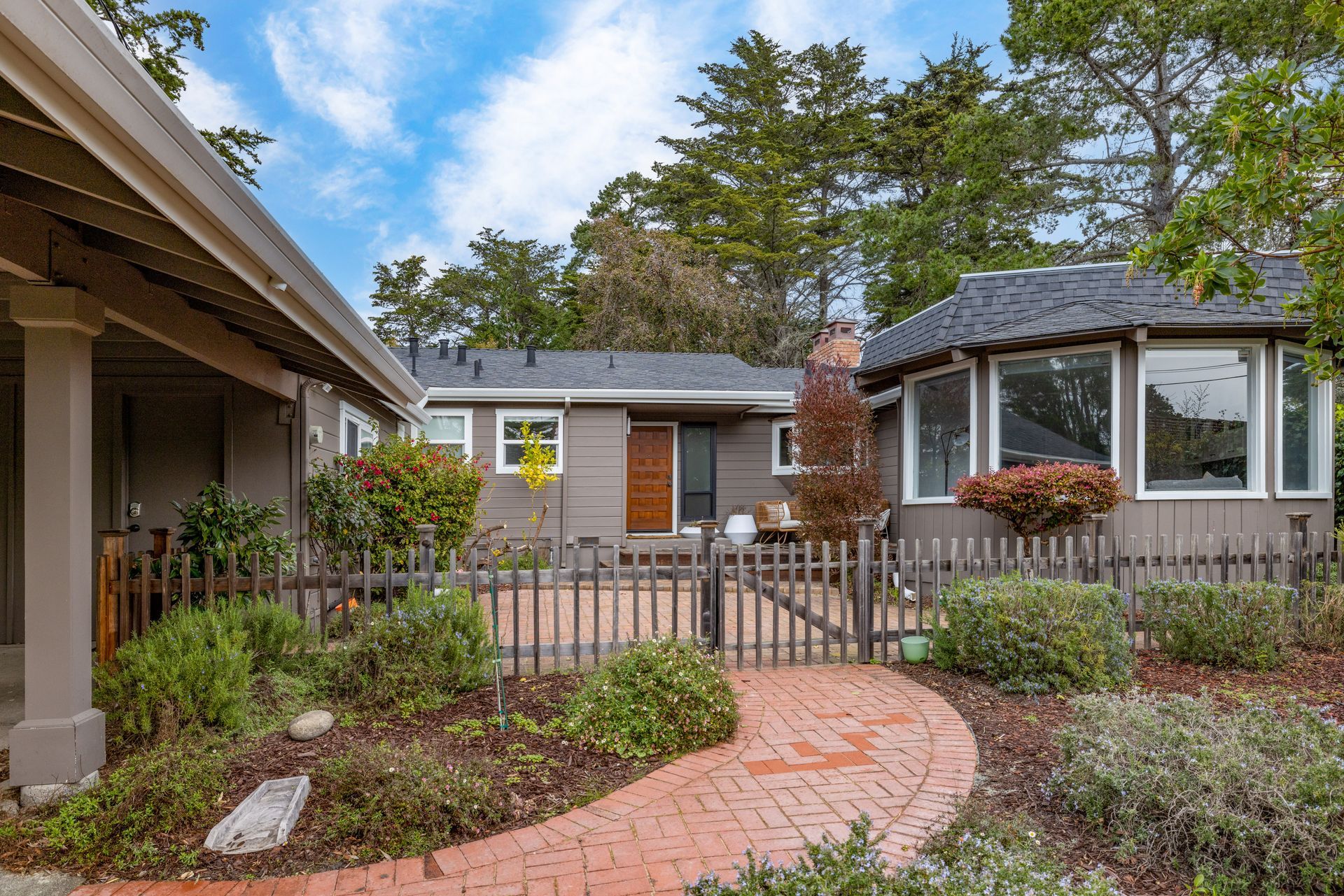 A house with a brick walkway leading to it