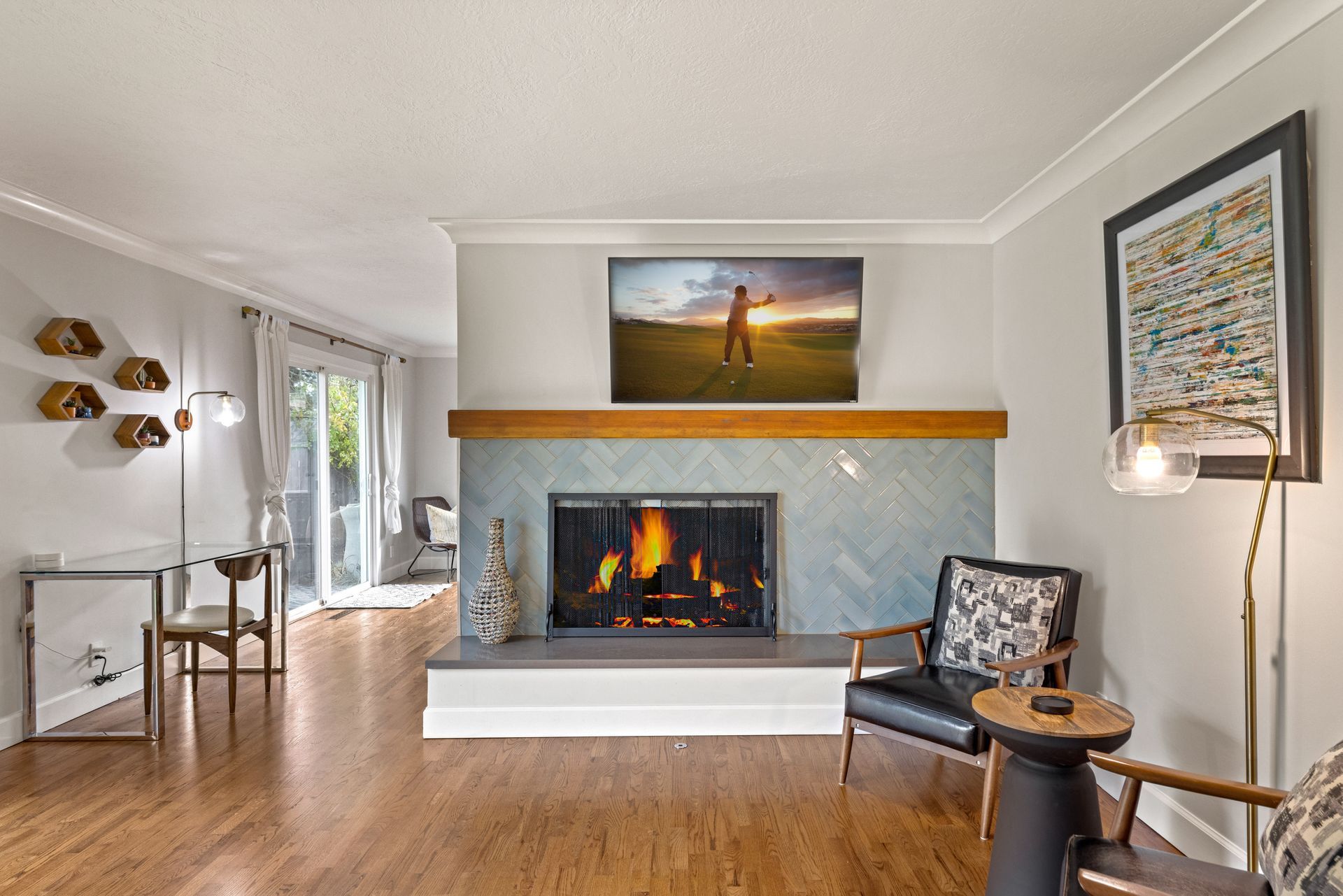 There is a fireplace in the middle of the living room.