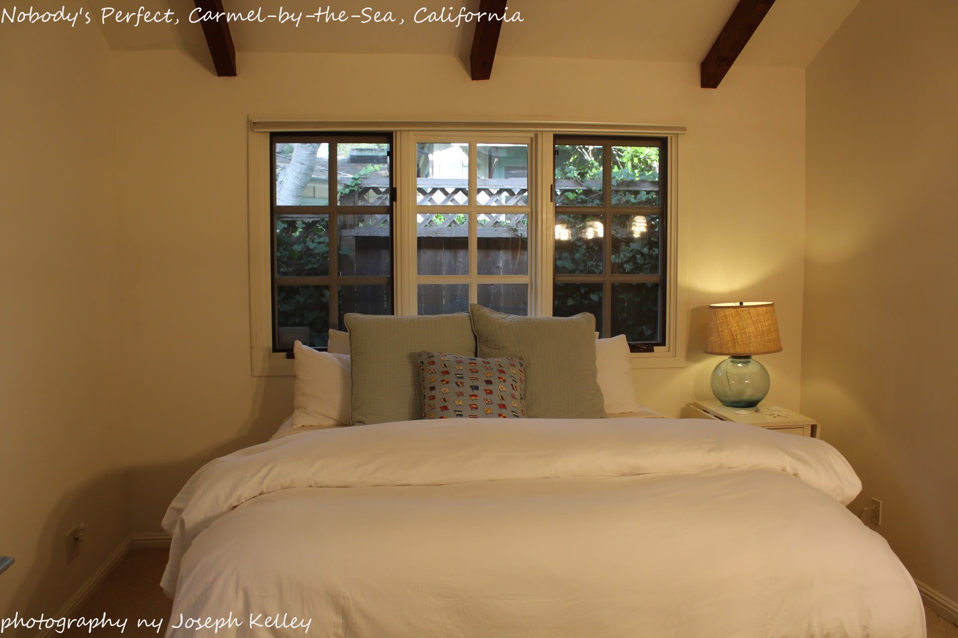 A bedroom in california with a bed and a window