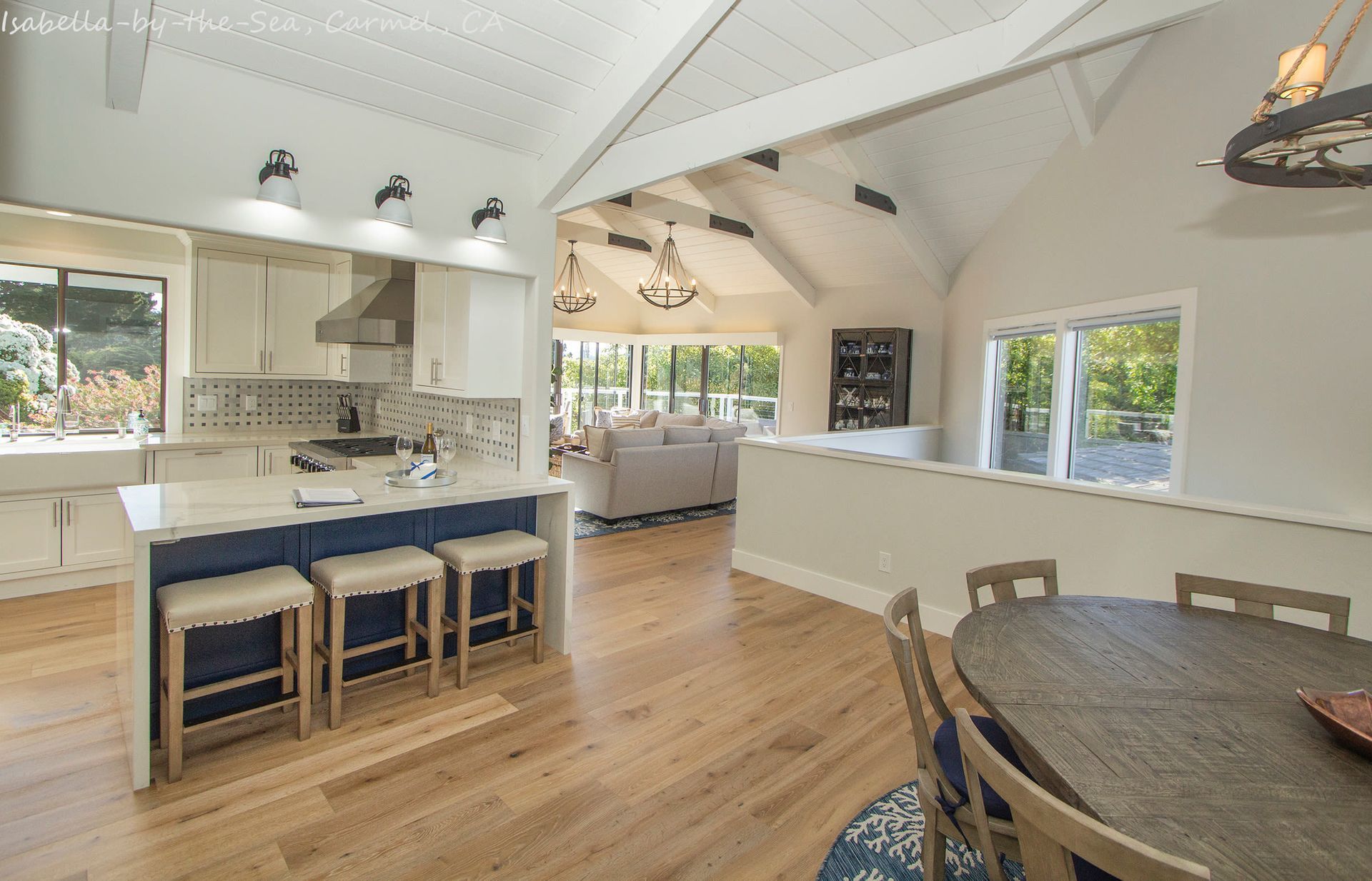 A kitchen with a table and chairs in it