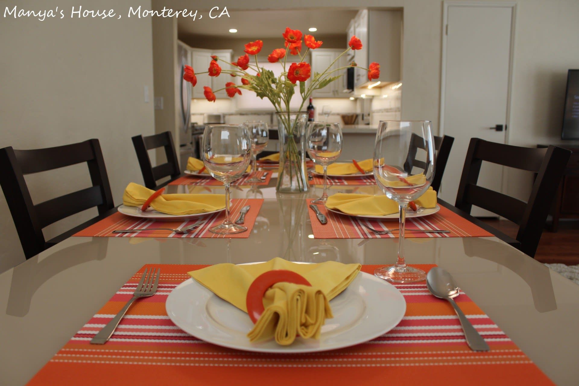 A white house with a gravel path leading to it