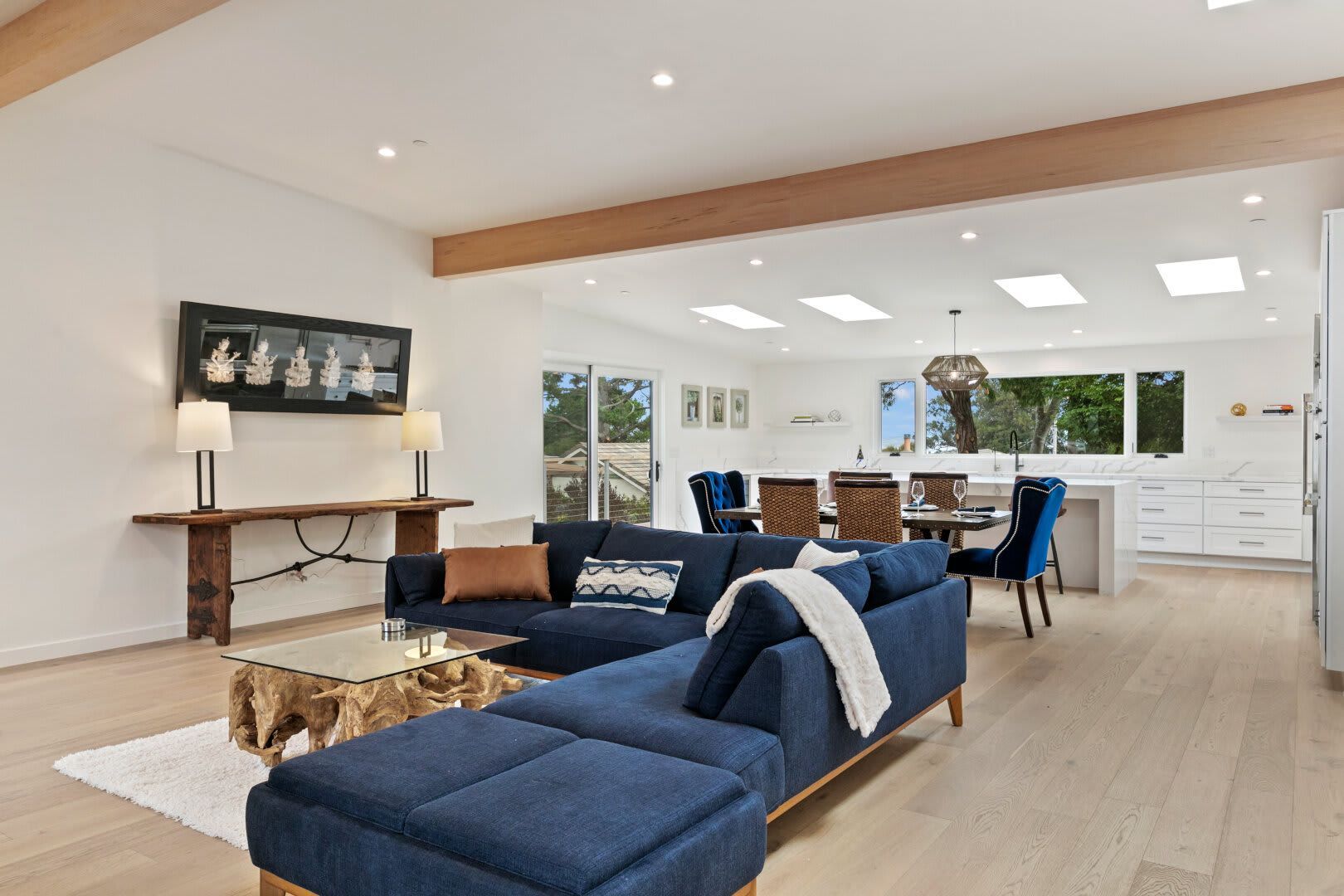 A living room with a blue couch and a coffee table