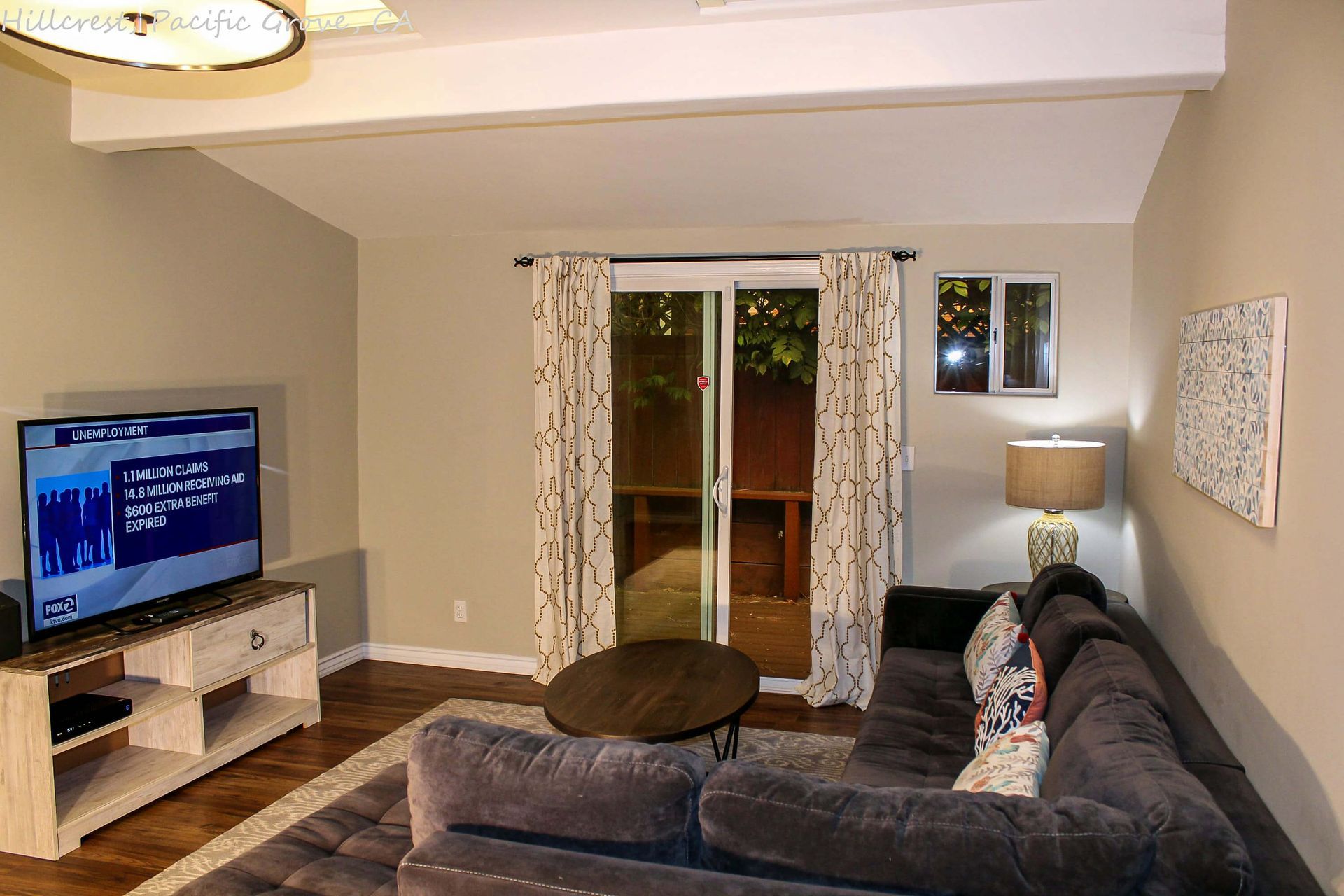A living room with a couch and a flat screen tv