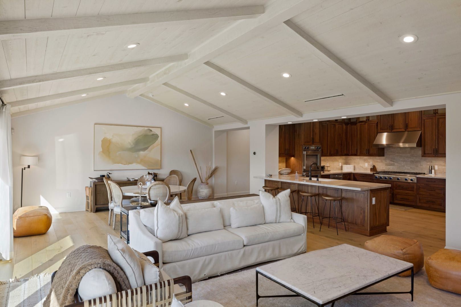 A living room with a white couch and a coffee table