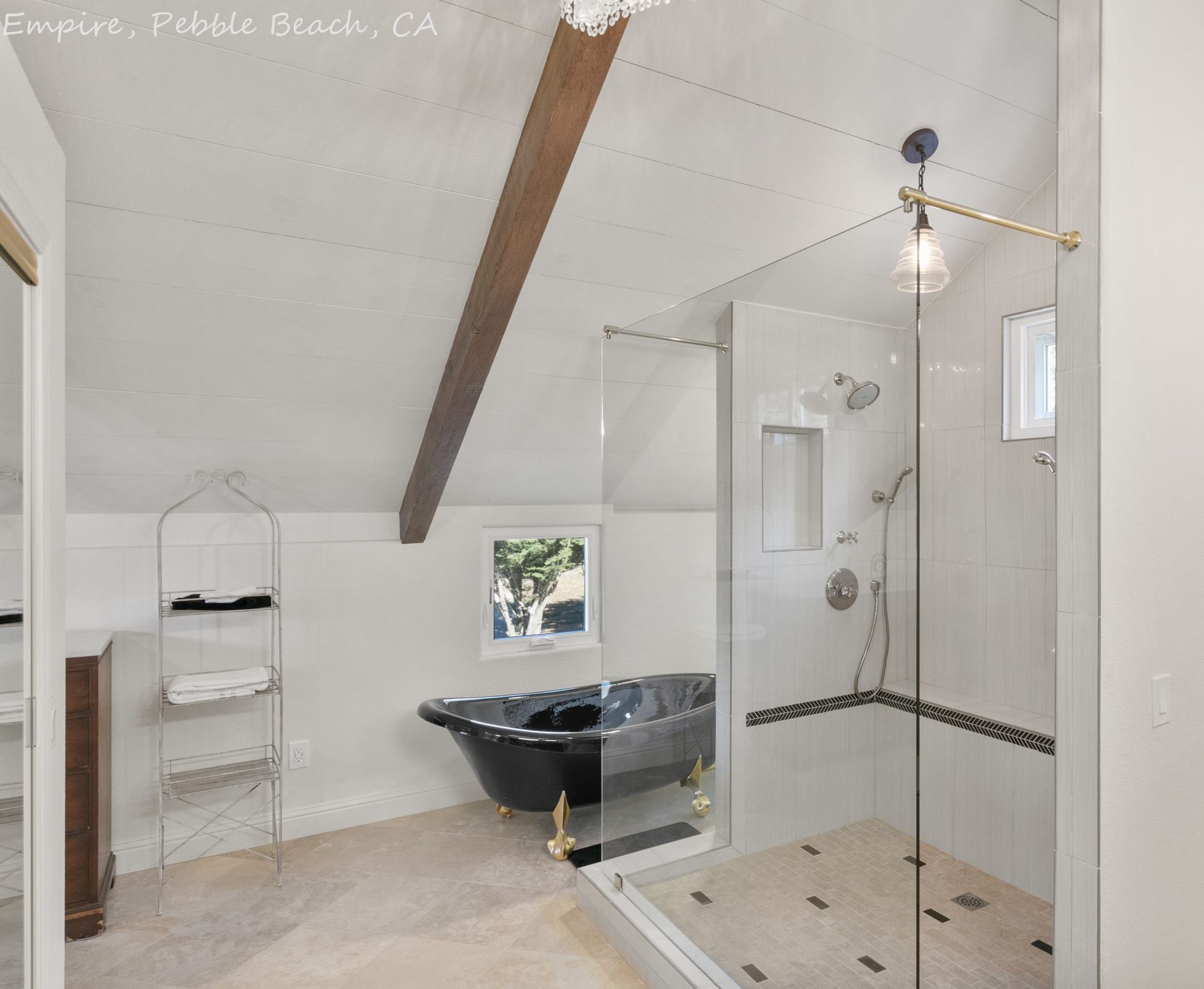 A bathroom with a bathtub and a walk in shower