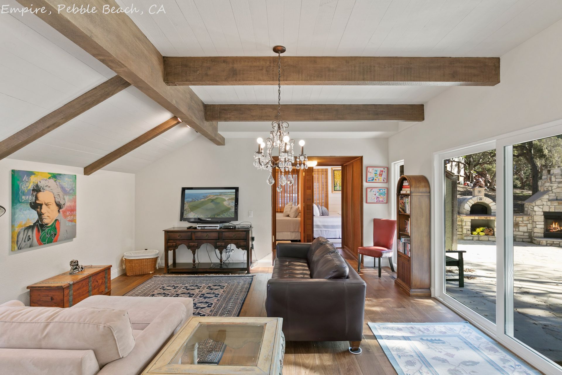 A living room with a couch and a television