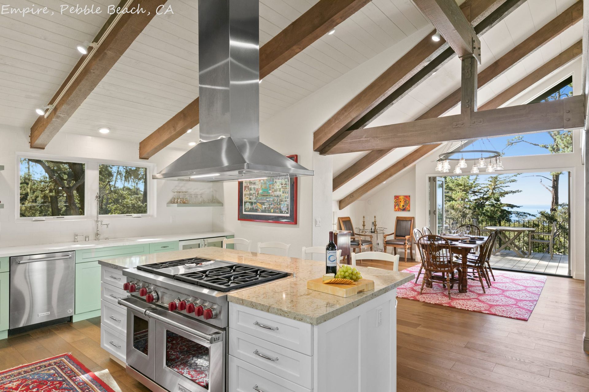 A kitchen with stainless steel appliances and a large island