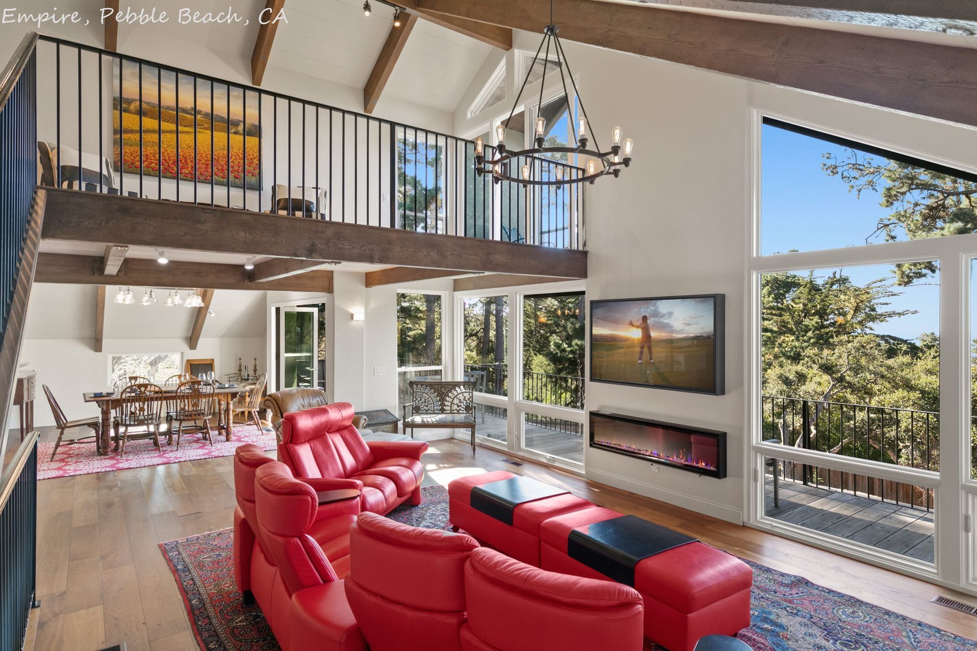 A large green house with a brick driveway in front of it