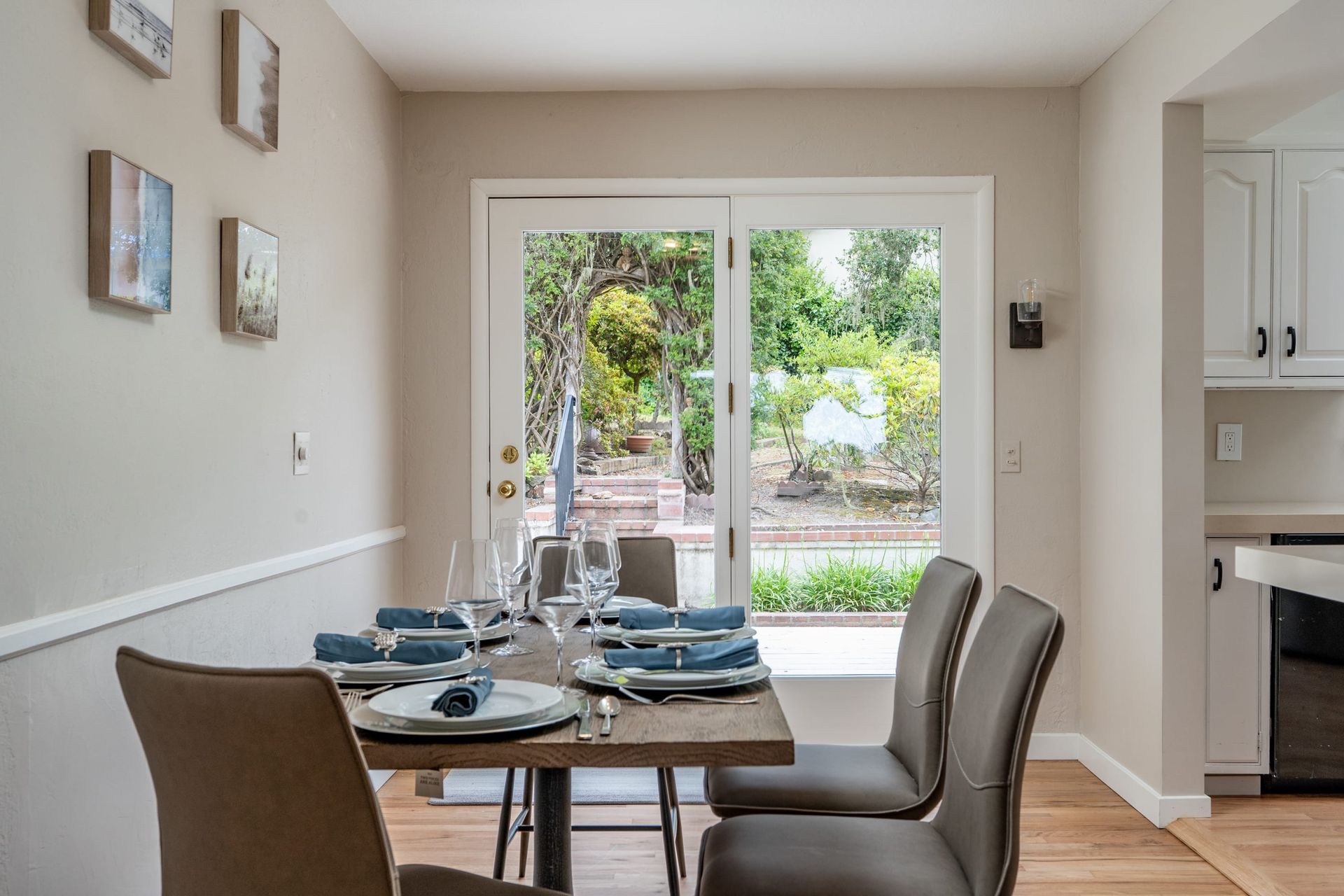 A house with a deck and a table and chairs on it