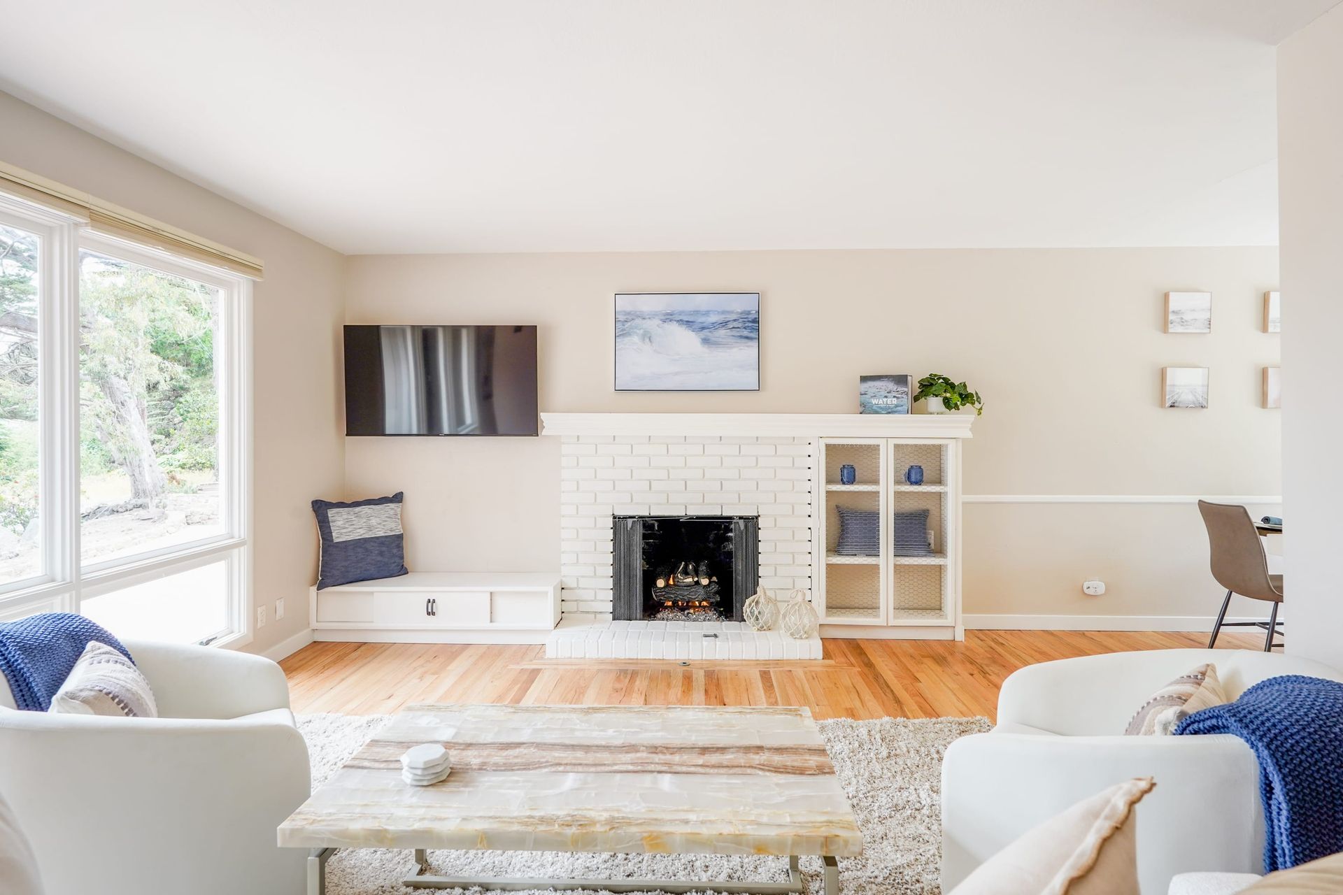 A living room filled with furniture and a fireplace.