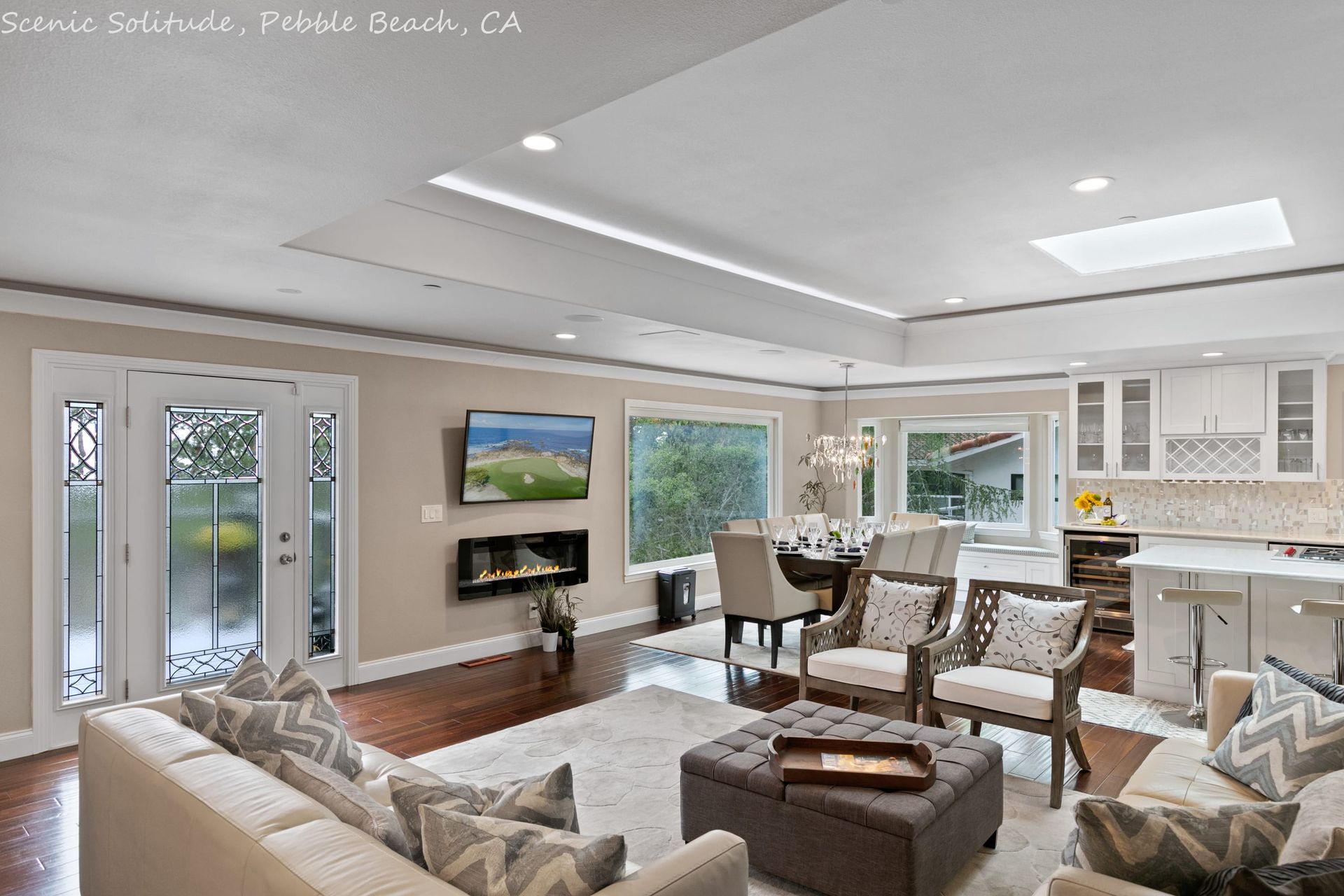 A living room with a couch and chairs and a fireplace