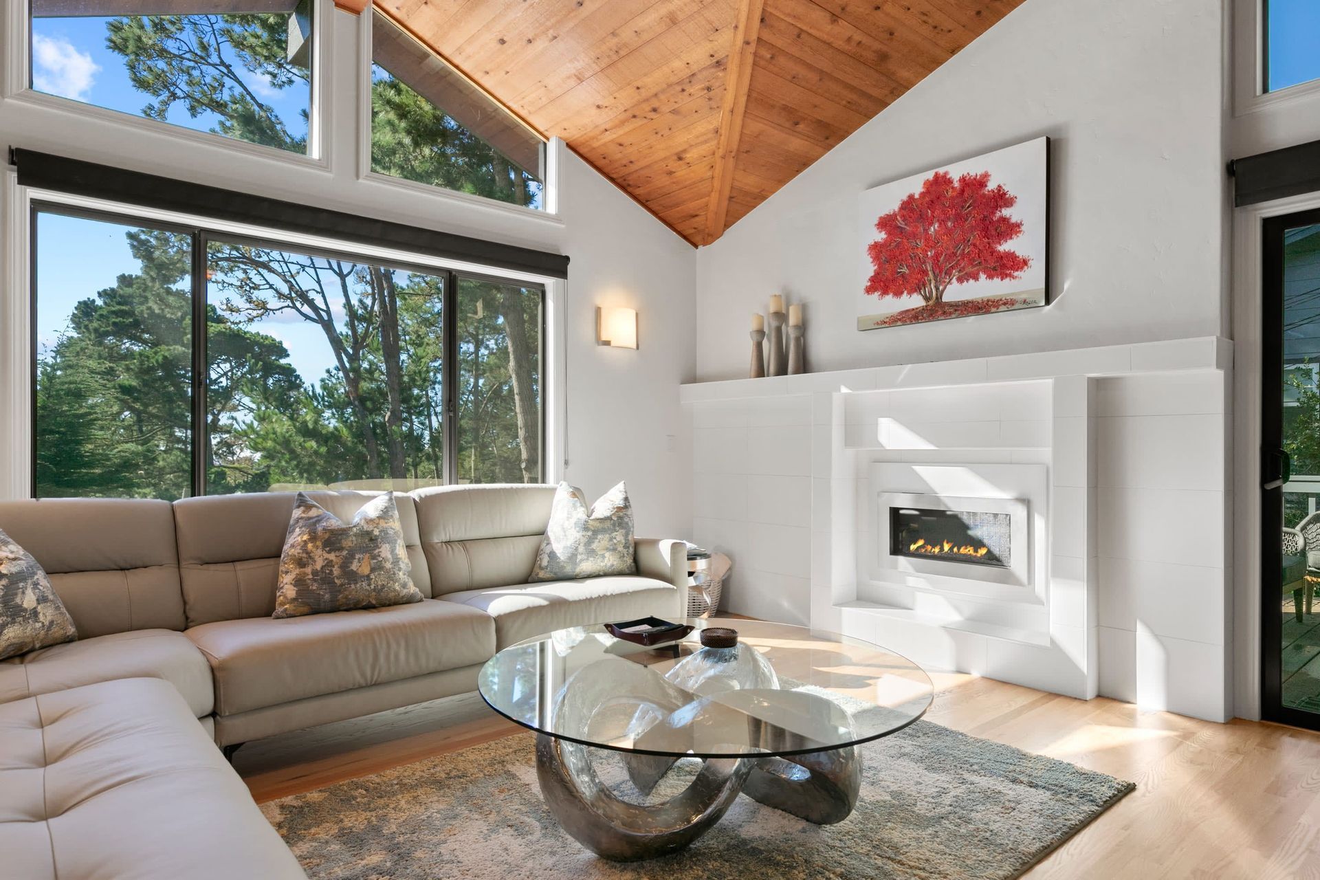 A living room with a couch , coffee table and fireplace.