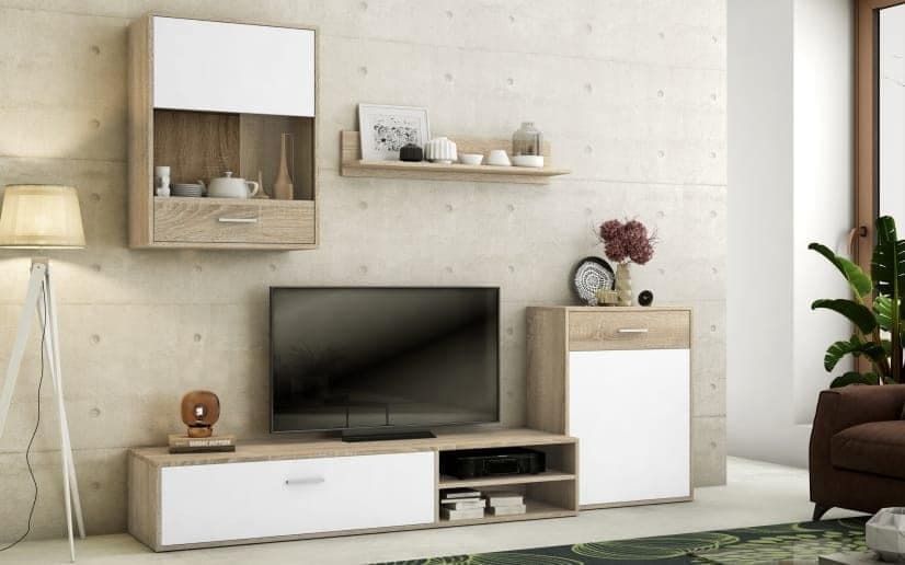 Una sala de estar con un televisor de pantalla plana sobre un soporte.