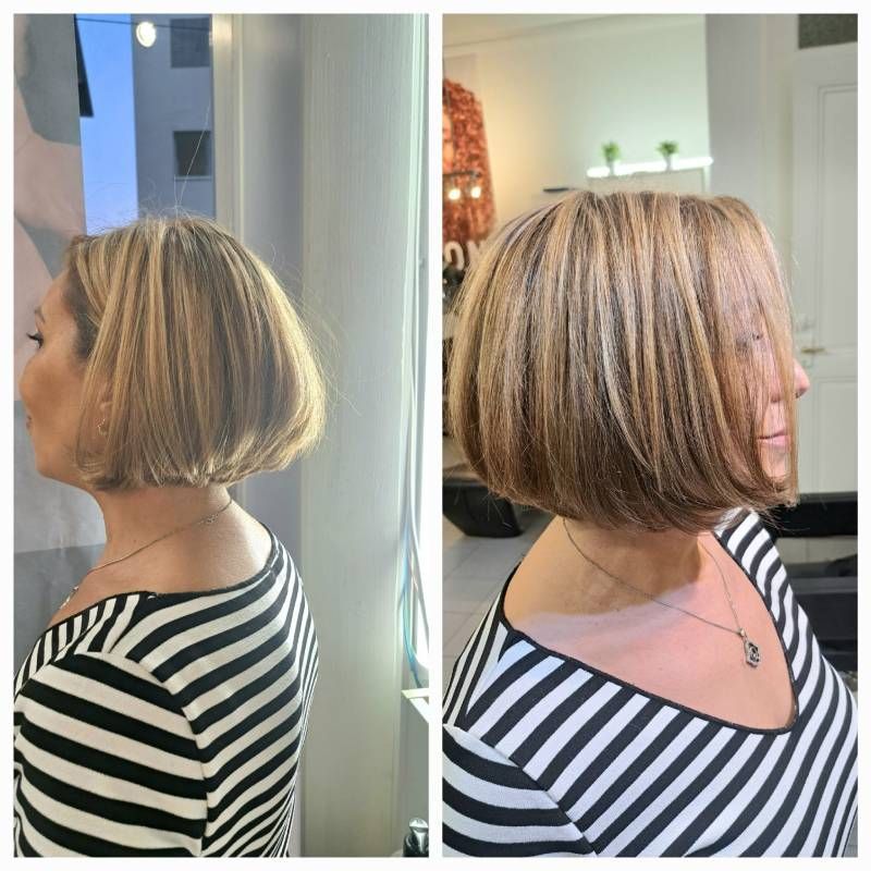 Une femme portant une chemise rayée a les cheveux coupés en carré.