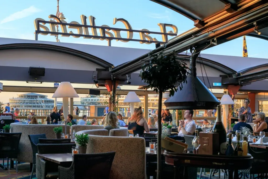 A group of people are sitting at tables in a restaurant