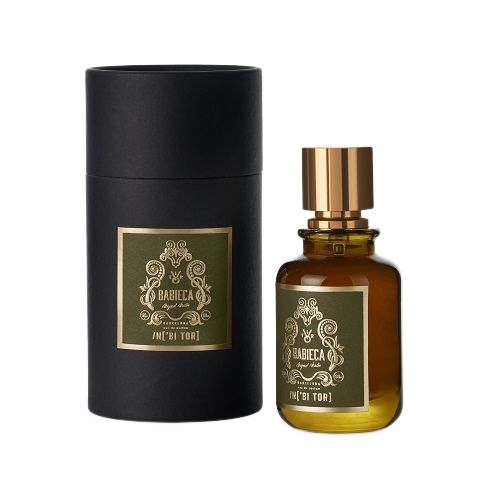 Caja de perfume cilíndrica negra y frasco de perfume marrón con detalles dorados y etiqueta verde.