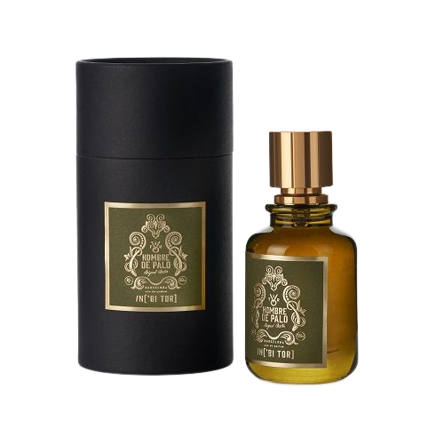 Frasco de perfume y su caja cilíndrica negra, etiqueta color oliva y detalles dorados.