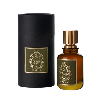 Un frasco de perfume y una caja cilíndrica. El frasco es marrón con un tapón dorado. La caja es negra.