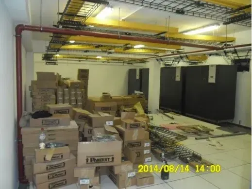 A bunch of boxes are stacked on top of each other in a room