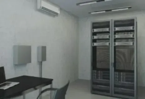 A room with a desk , chair , computer and servers.