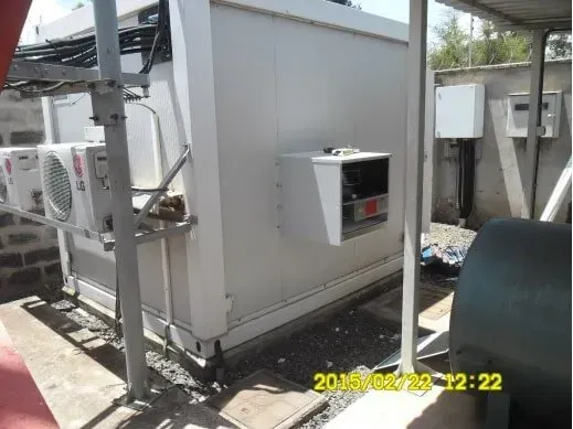 A picture of a building with air conditioners