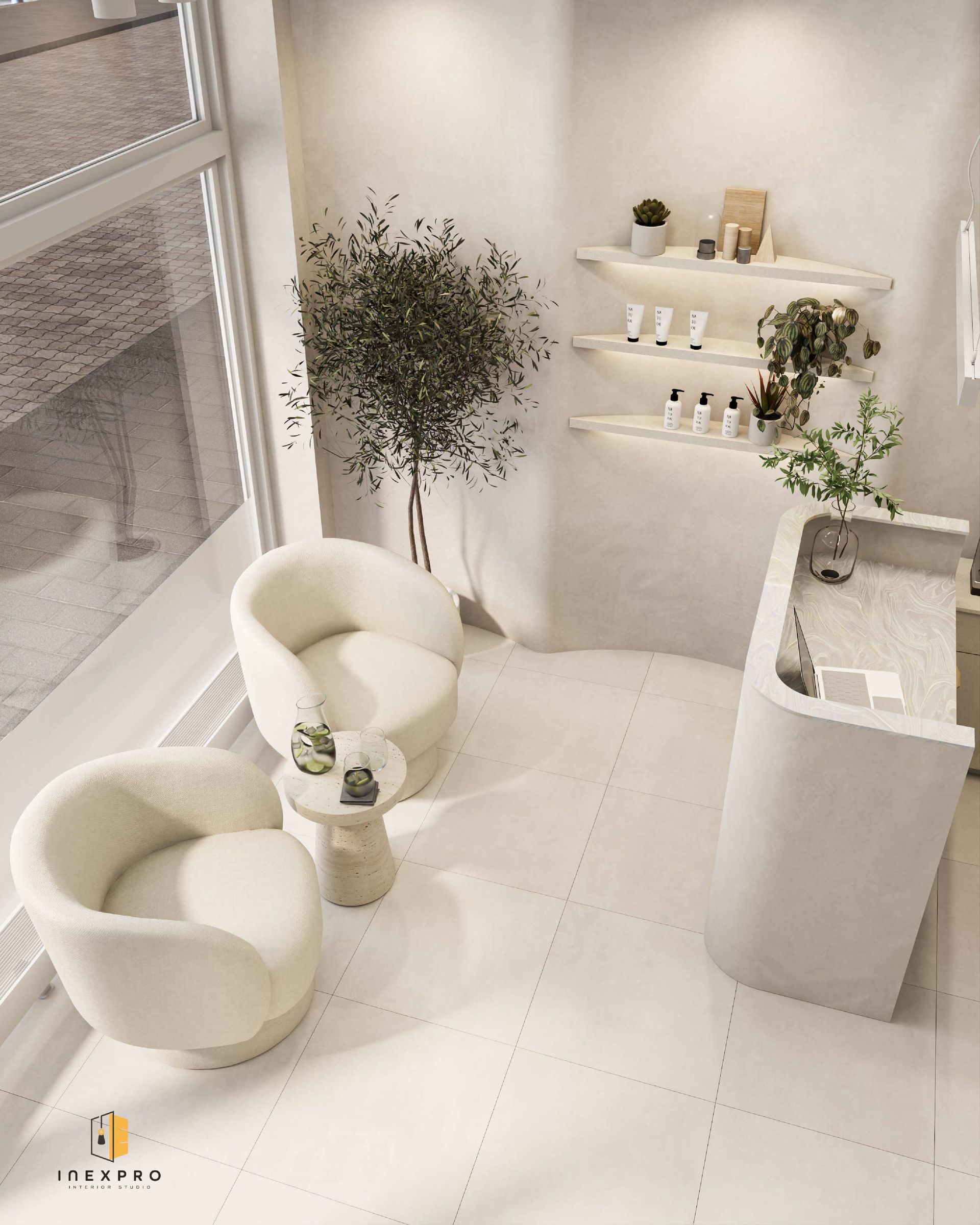 Gemütliches, weisses Interieur mit zwei Sesseln, einem kleinen Tisch, einer Theke und einem Regal mit Produkten und Pflanzen.