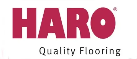 El logotipo de suelos de calidad Haro es rojo y blanco sobre un fondo blanco.