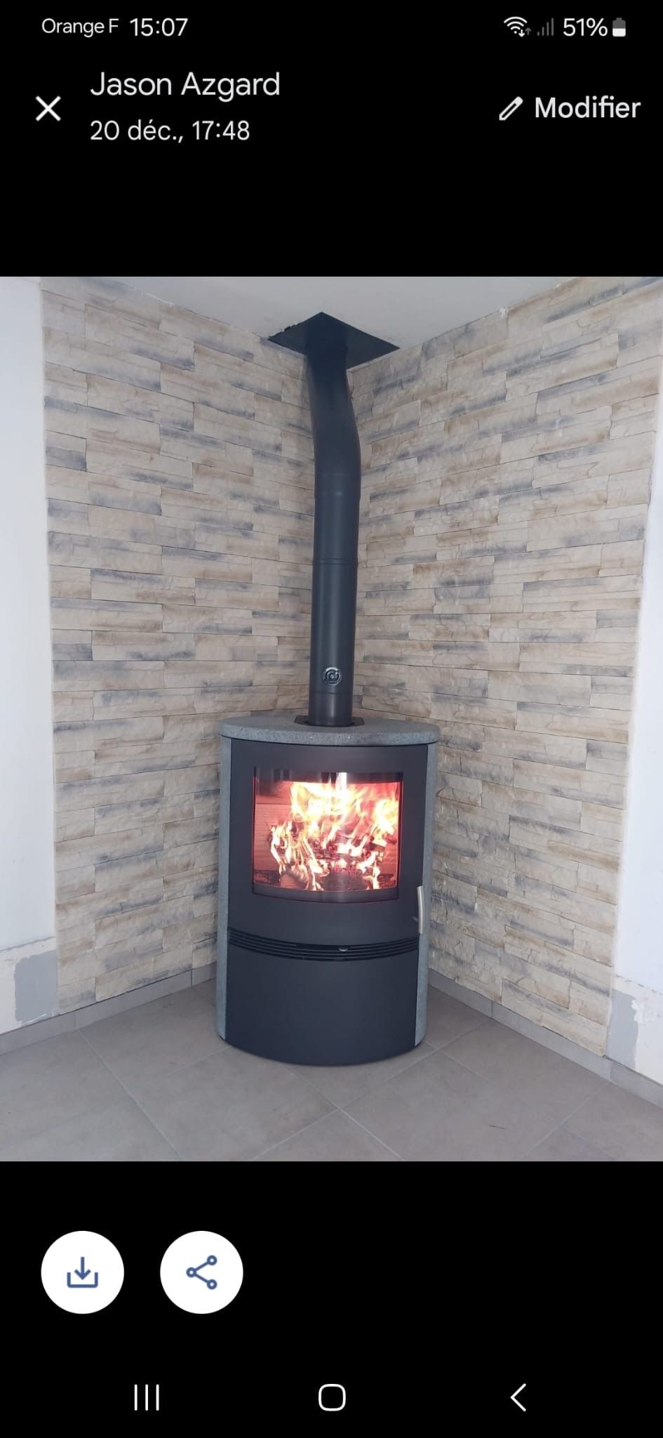 Pose de parement derrieère un poele à bois